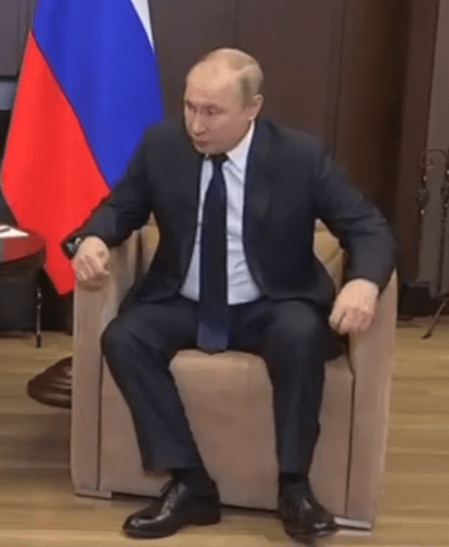 Putin keeps moving his hands and twitching his feet as he sits with Lukashenko