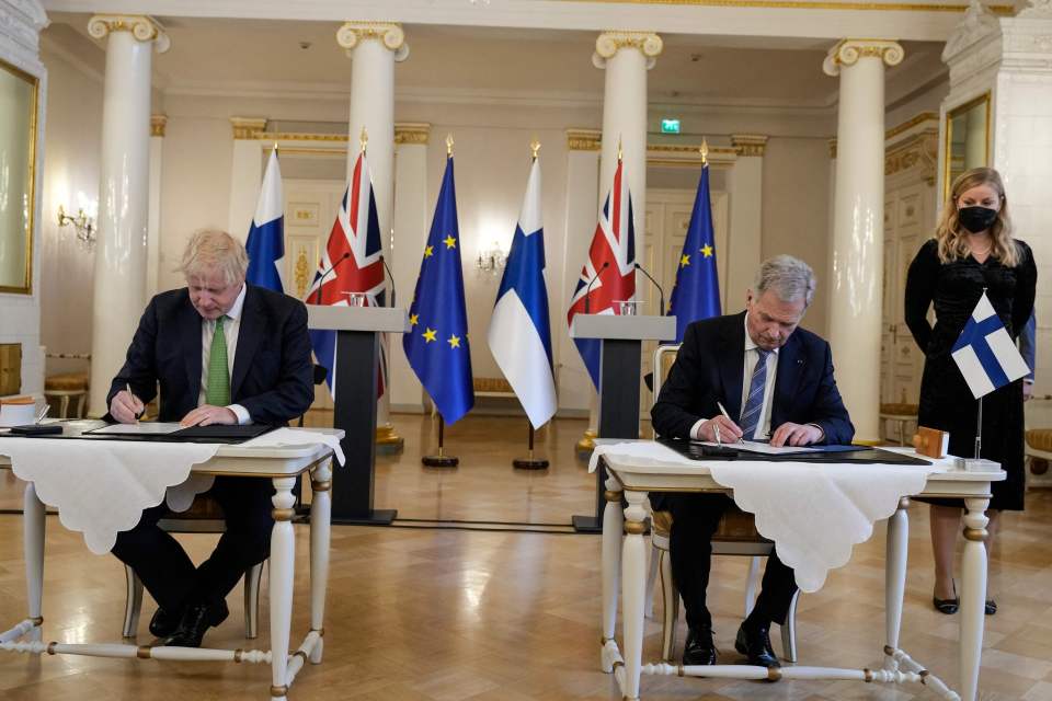 Johnson was greeted by Finland President Sauli Niinistö for the signing at the Presidential Palace in Helsinki