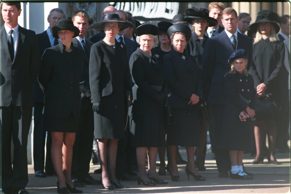 Queen and members of the Royal Family gather at the gates of Buckingham Palace at Princess Diana's funeral