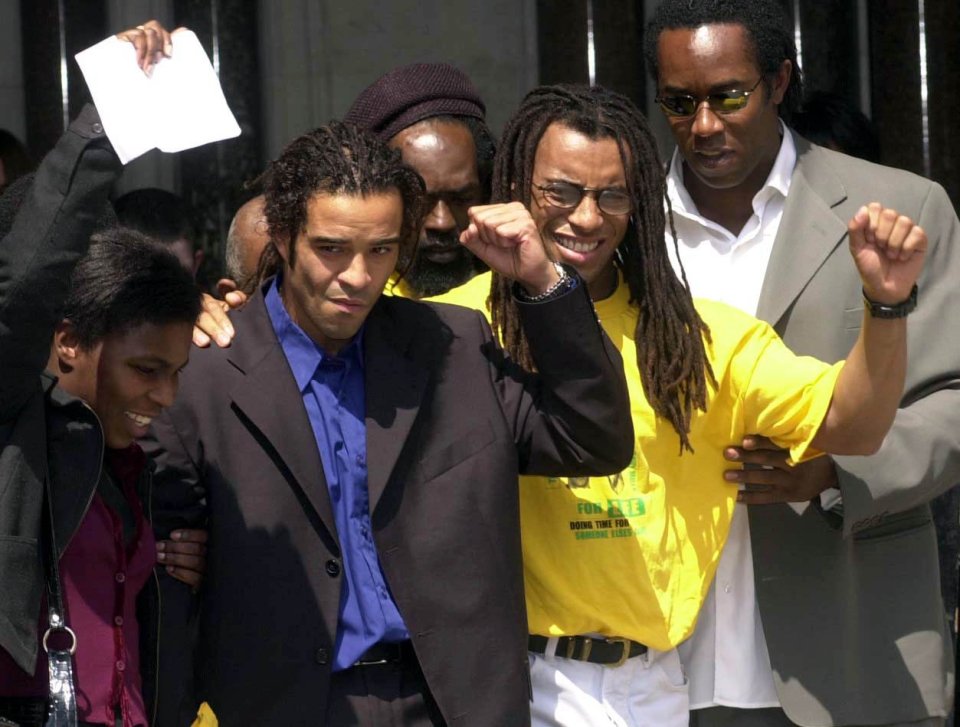 Two members of the so-called M25 Three, Raphael Rowe (left) and Michael Davis talk to the media after their release at the High Court, London, on July 17, 2000