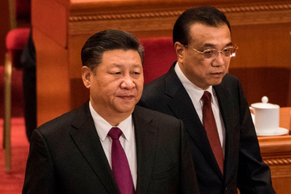 China's President Xi Jinping, left, and Premier Li Keqiang are said to be split on the future of the economy