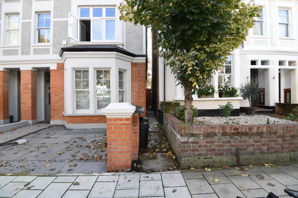 Mr MacPhail's house, left, and Mr Gueterbock's home, right, are separated by a passageway