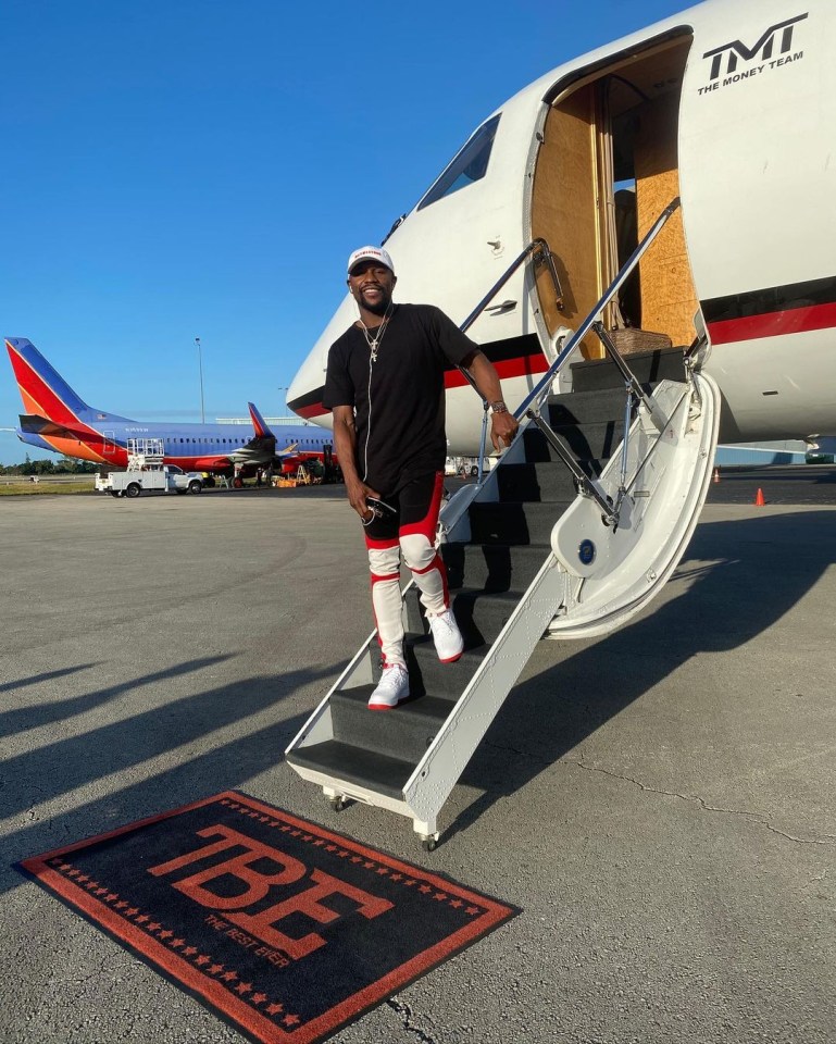 Floyd Mayweather posing by his private jet