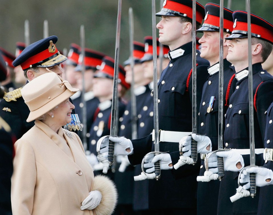 Her Majesty grinned when she saw Prince Harry while inspecting a graduation parade of officer cadets at the Royal Military Academy in Sandhurst