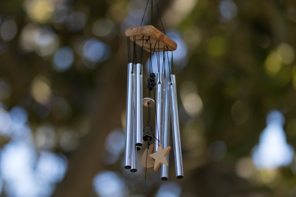 A wind chime sounds lovely and can discourage pesky pigeons