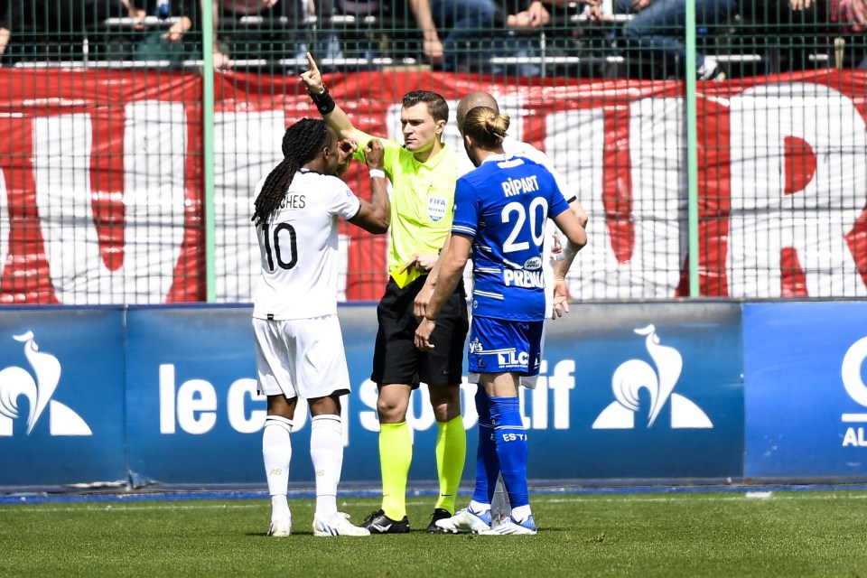 Ref Willy Delajod tells Sanches to exit to pitch as the midfielder attempts to explain a binoculars gesture he made