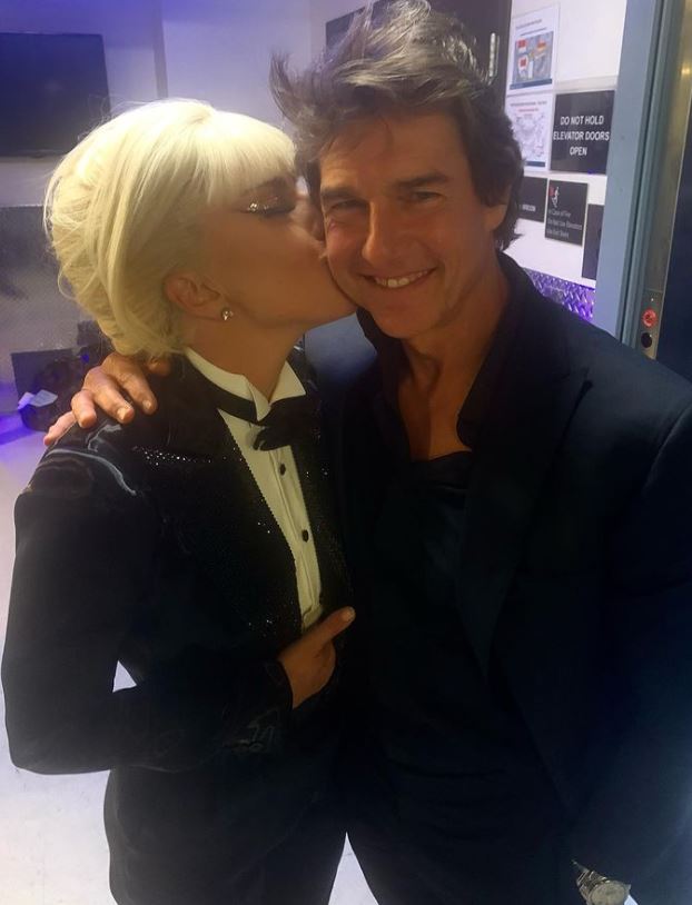 Tom Cruise looked delighted to catch up with Lady Gaga backstage