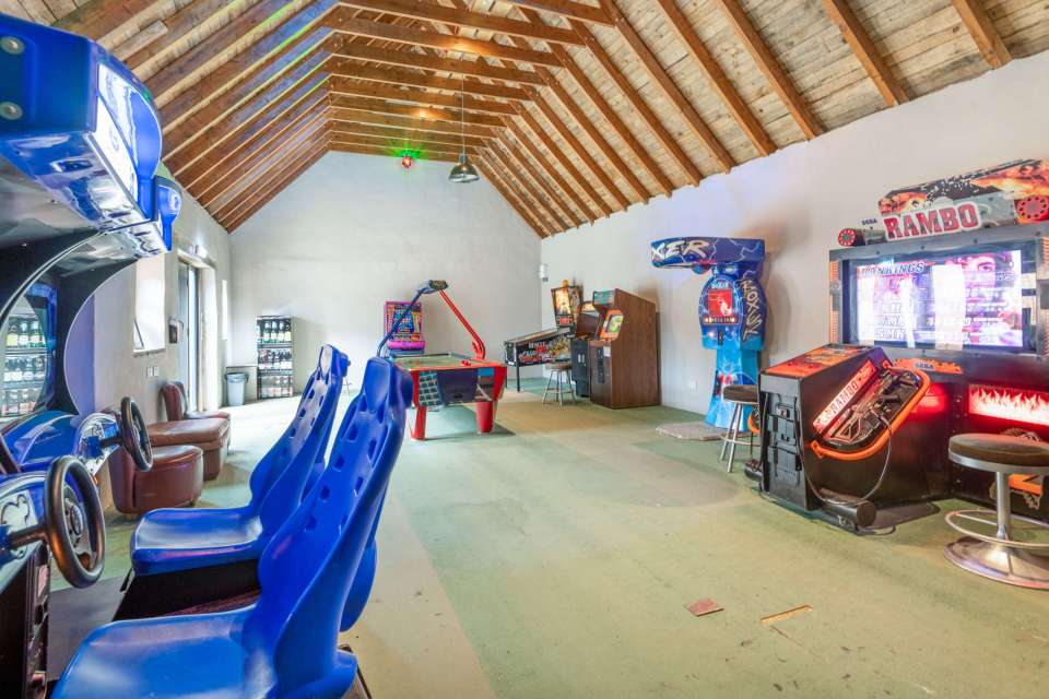 The property comes with its own arcade room to keep everyone entertained