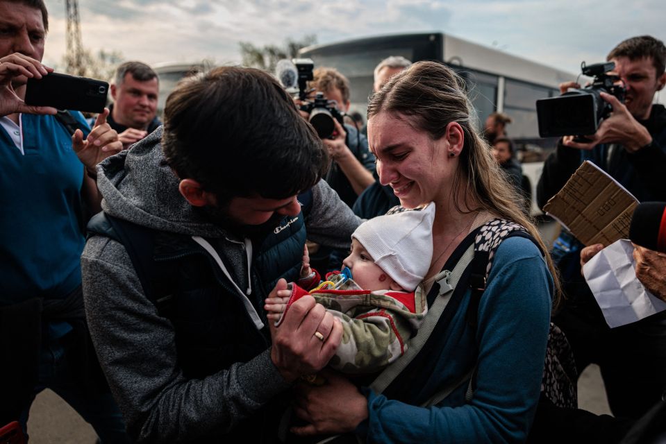 A mum and her baby at a refugee site after escaping to safety