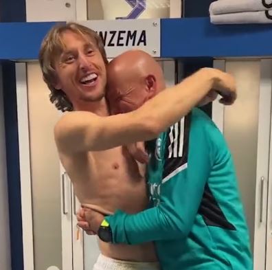 Luka Modric hugs fitness coach Antonio Pintus during the party