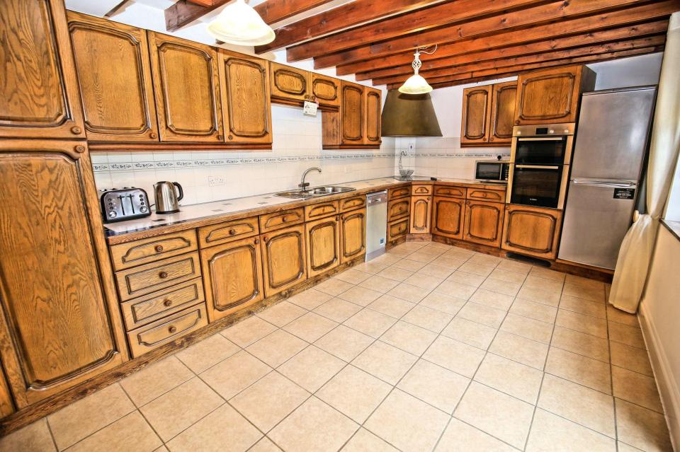 It has a large rustic kitchen