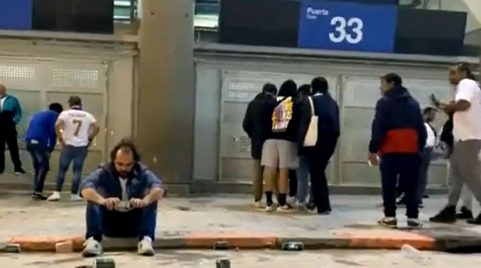 Some Madrid fans that left the stadium too early stayed to listen at the gates of the Bernabeu