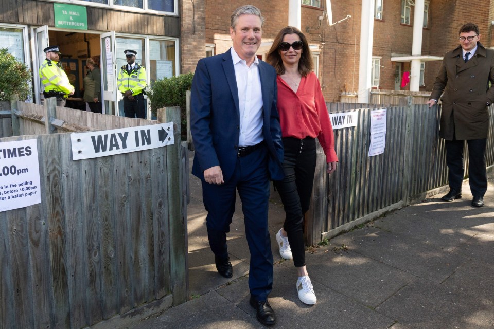 Labour leader Keir Starmer and his wife Victoria Starmer leave a polling station on Thursday