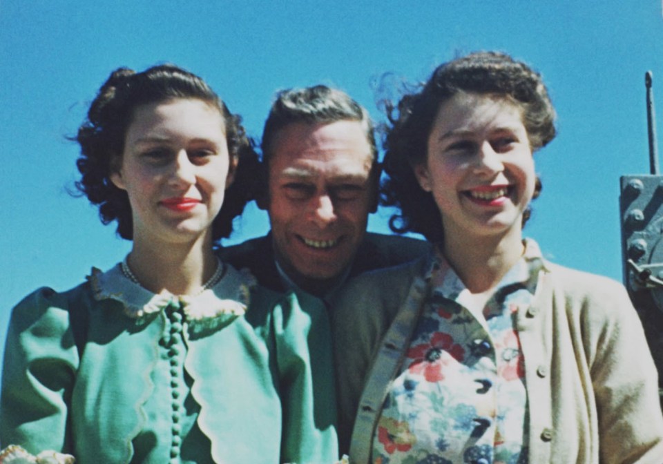 In another moment from Elizabeth Unseen, the ­princess poses with sister Princess Margaret and King George VI on board HMS Vanguard in 1947