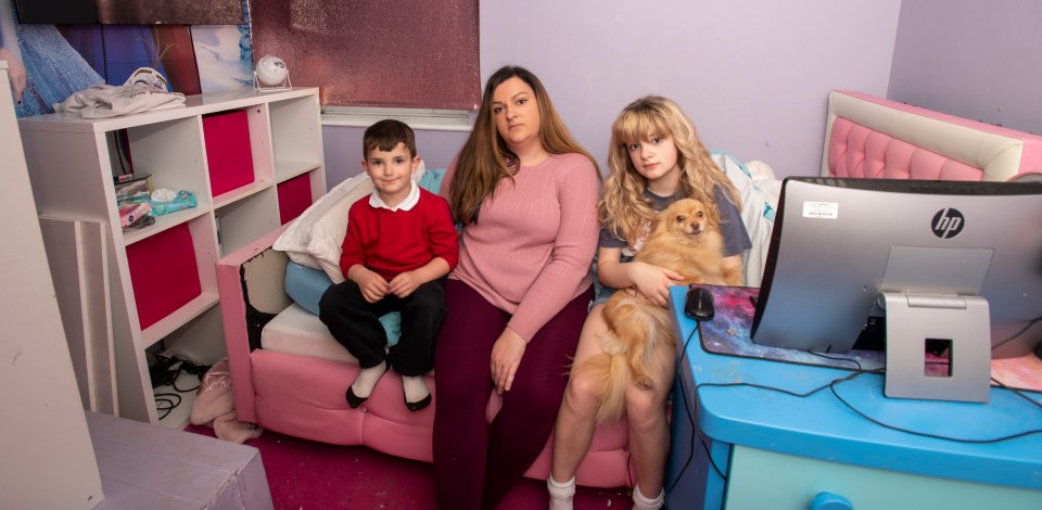 Michaela with two of her children and their dog