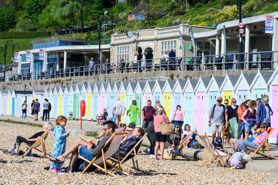 The beach at Lyme Regis, Dorset, was filling up quickly as people made the most of the sunshine