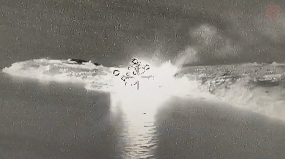 An aerial view shows an explosion at Snake Island