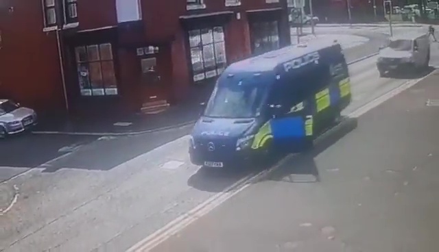 A police van pulls up outside the pub