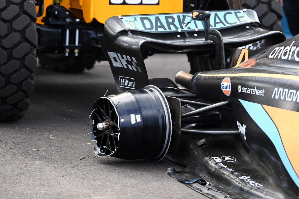 McLaren's Lando Norris was forced to retire after losing a wheel in a crash with Pierre Gasly