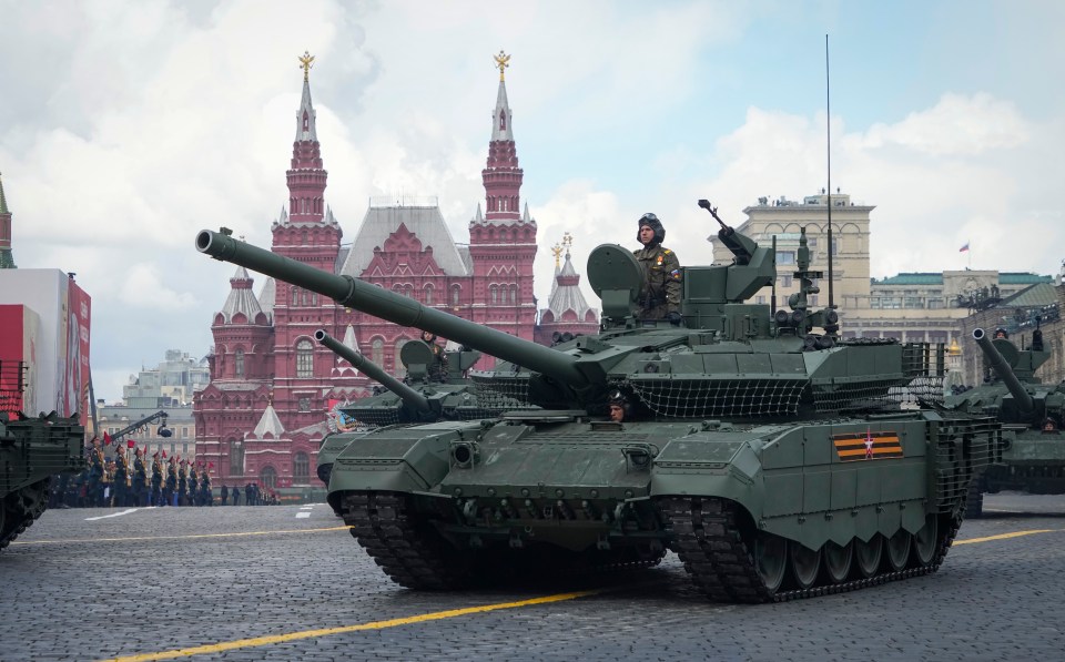 Russian tanks roll during the Victory Day military parade in Moscow on May 9