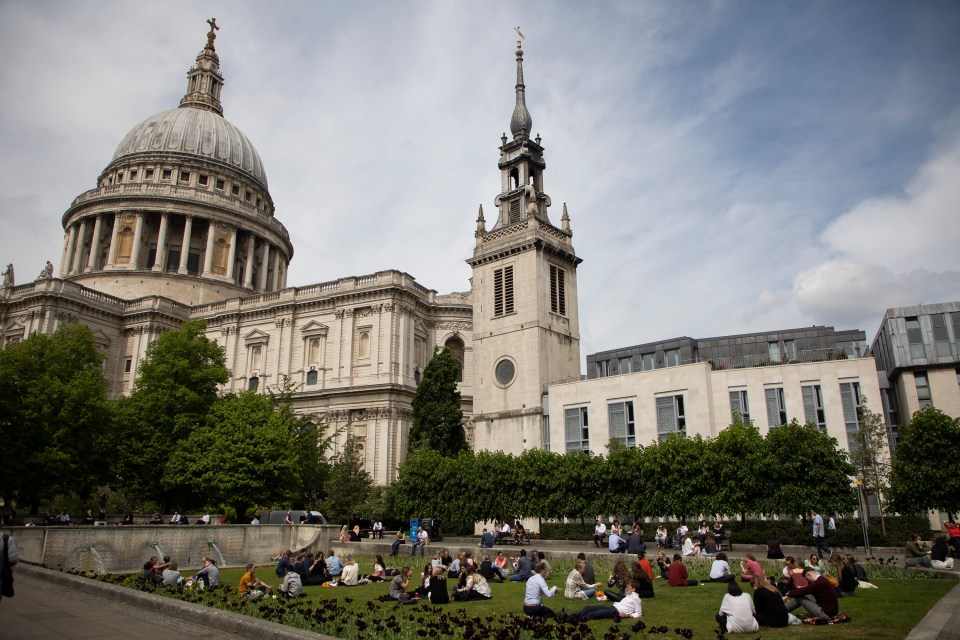 Londoners picnic in the gardens near St Paul’s Cathedral