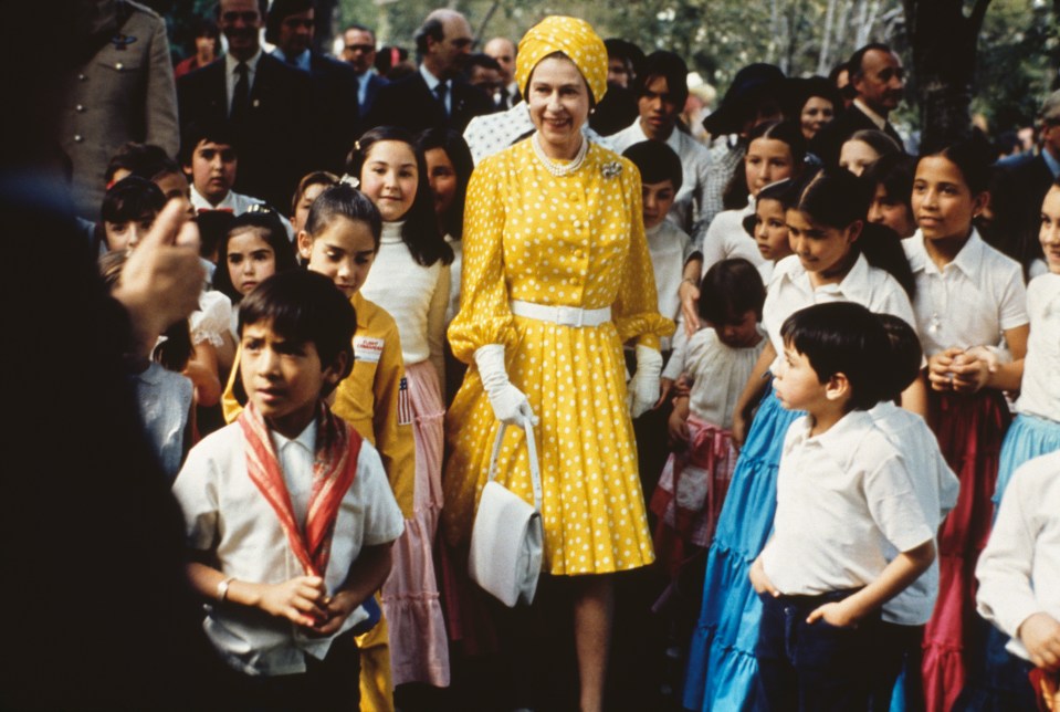 The Queen with a group of local children during her state visit to Mexico