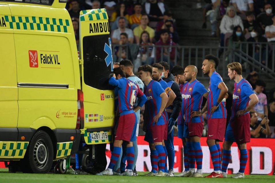 Concerned Barcelona stars watched on as Araujo was taken away