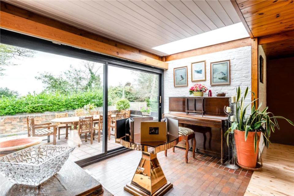 It boasts floor to ceiling windows and French doors