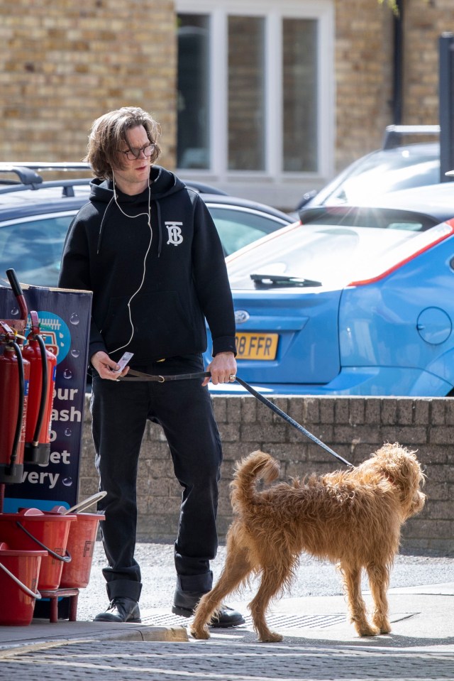 Matt looked very different as he walked his dog in London