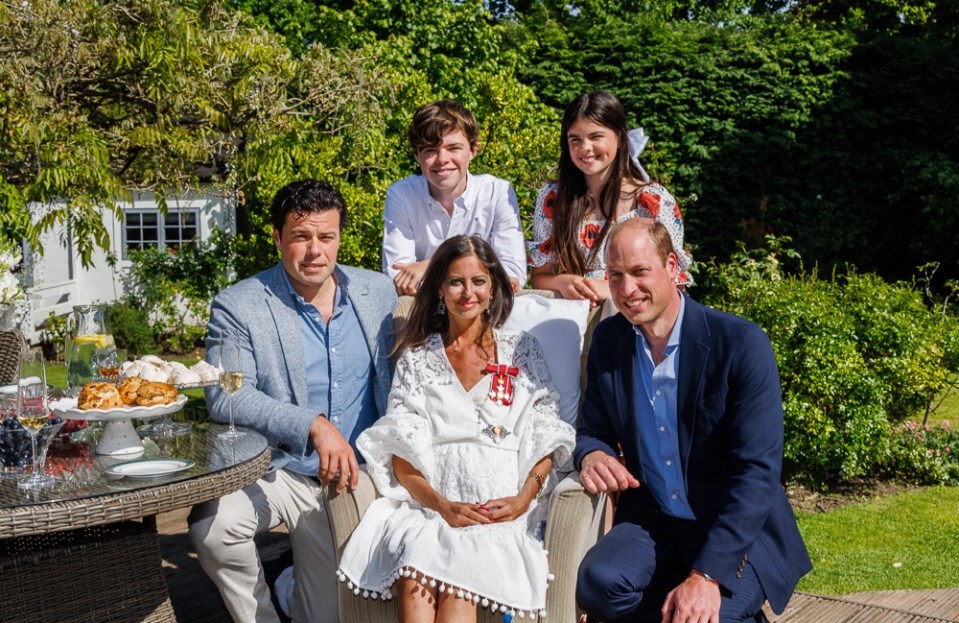 The 40-year-old has also raised over £6million for her BowelBabe fund and hopes to reach the £7million mark. Debs is pictured above receiving her damehood from Prince William, her husband Sebastien Bowen, 14 year old son Hugo and 12 year old daughter Eloise