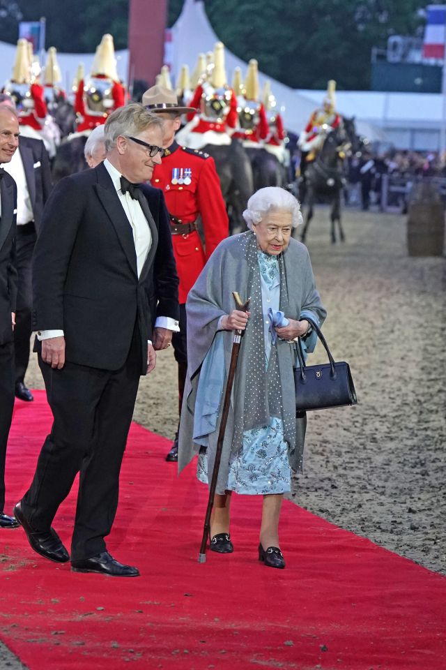 Queen Elizabeth II was accompanied by aides dressed in tuxedos