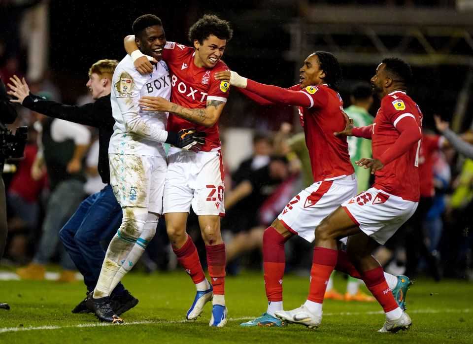 Samba was mobbed by his Forest team-mates after saving the crucial kick