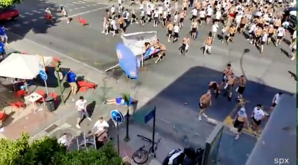 The German followers used a giant umbrella as protection