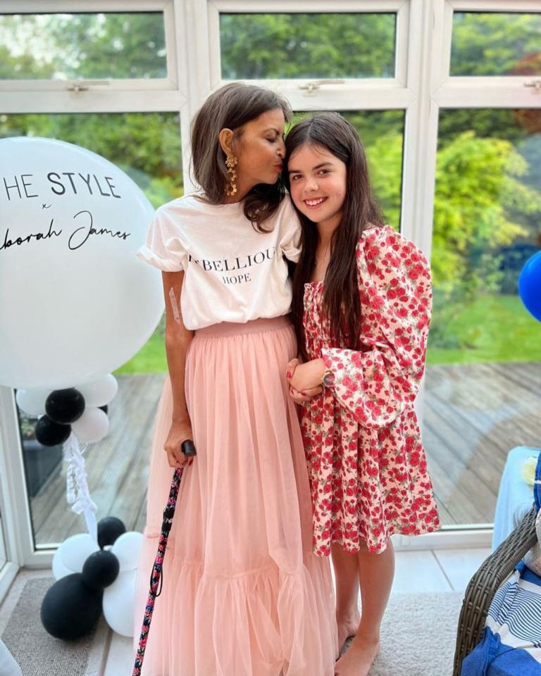 Deborah with her daughter, Eloise, posing with the T-shirts