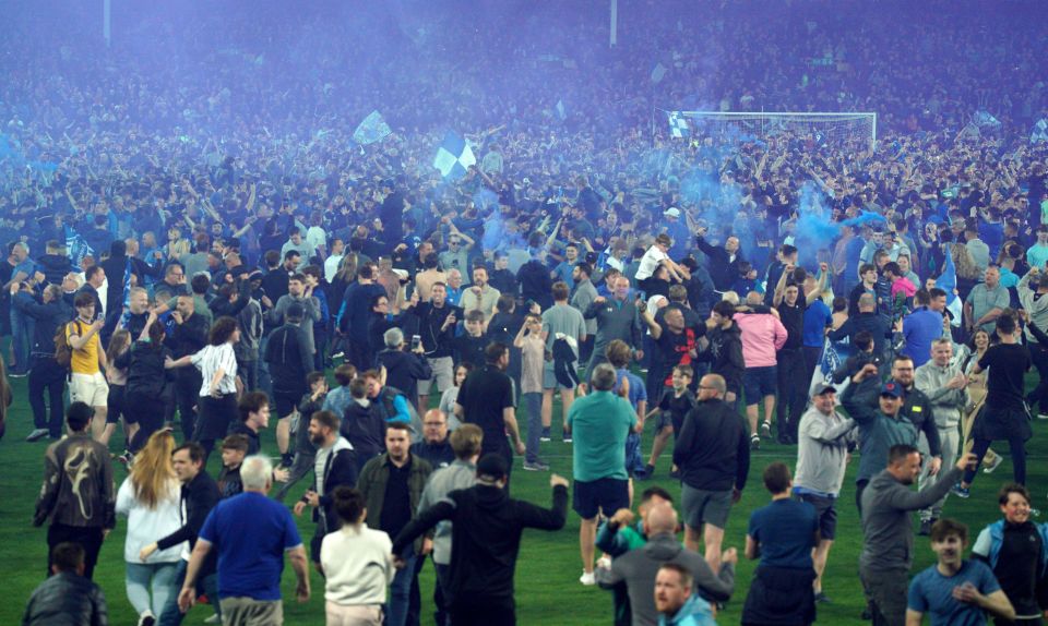 Everton fans invaded the pitch after securing their Premier League safety