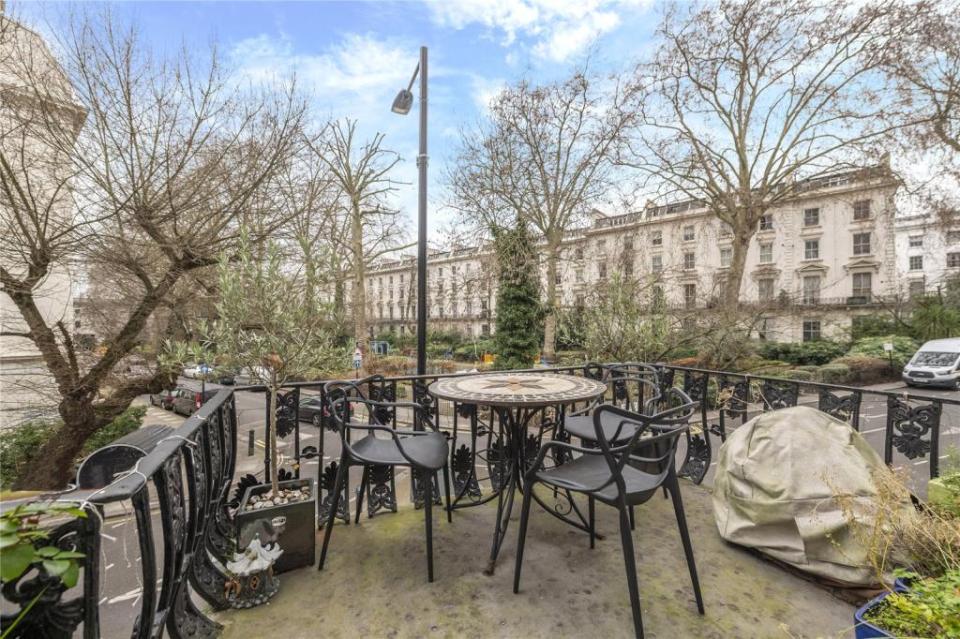 The maisonette features its own balcony, which overlooks a lovely square opposite