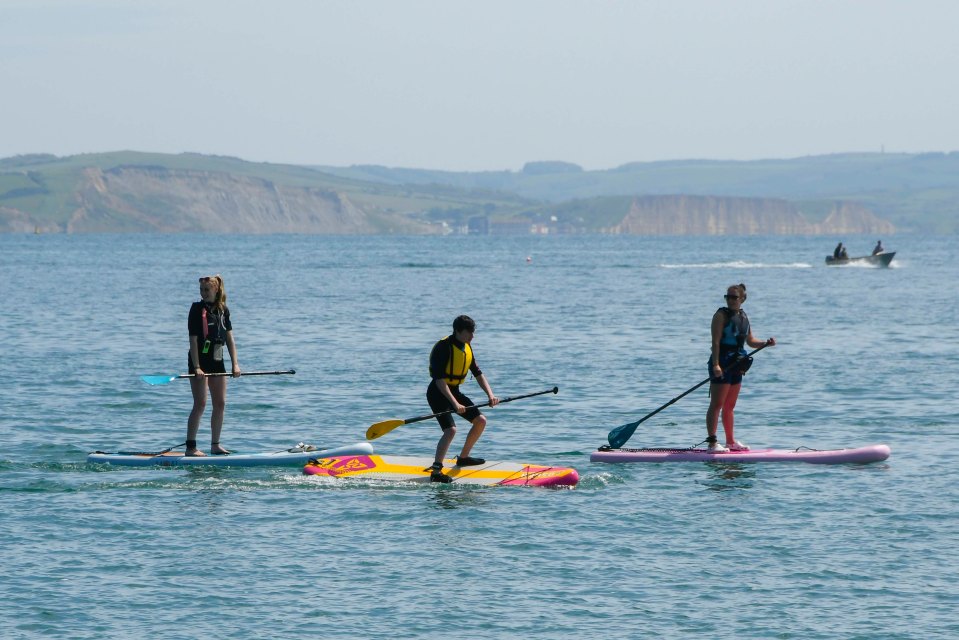 Paddle boarders enjoyed the scorching hot sunshine last weekend at the seaside resort of Lyme Regis in Dorset