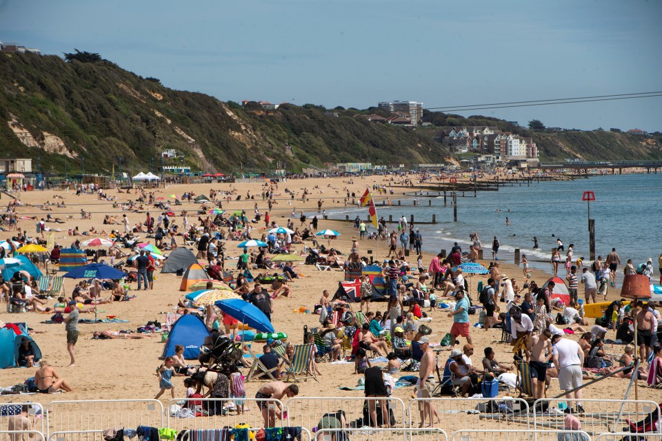 Beach goers enjoyed golden sands and blue skies in Dorset yesterday