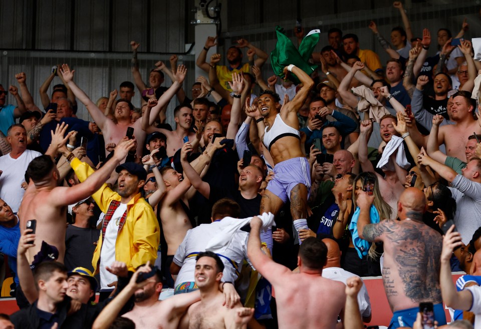 Raphinha joins fans in the stands to celebrate Leeds keeping their Prem place