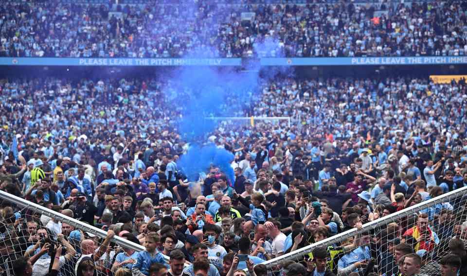 Hoards of Man City fans stormed the pitch to celebrate their sensational title win