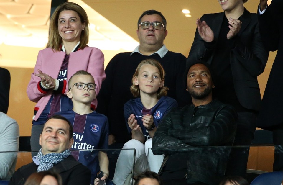 Pimenta sits alongside Raiola at the Parc des Princes watching PSG in 2017