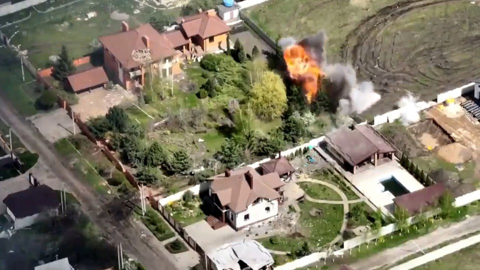 The tanks can be seen engulfed in flames after a strike by Ukraine