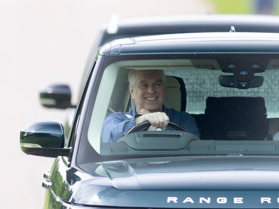 Prince Andrew was spotted smiling broadly as he drove his Range Rover in Windsor today