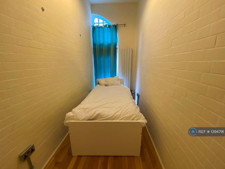 One of the bedrooms is being compared to a prison cell