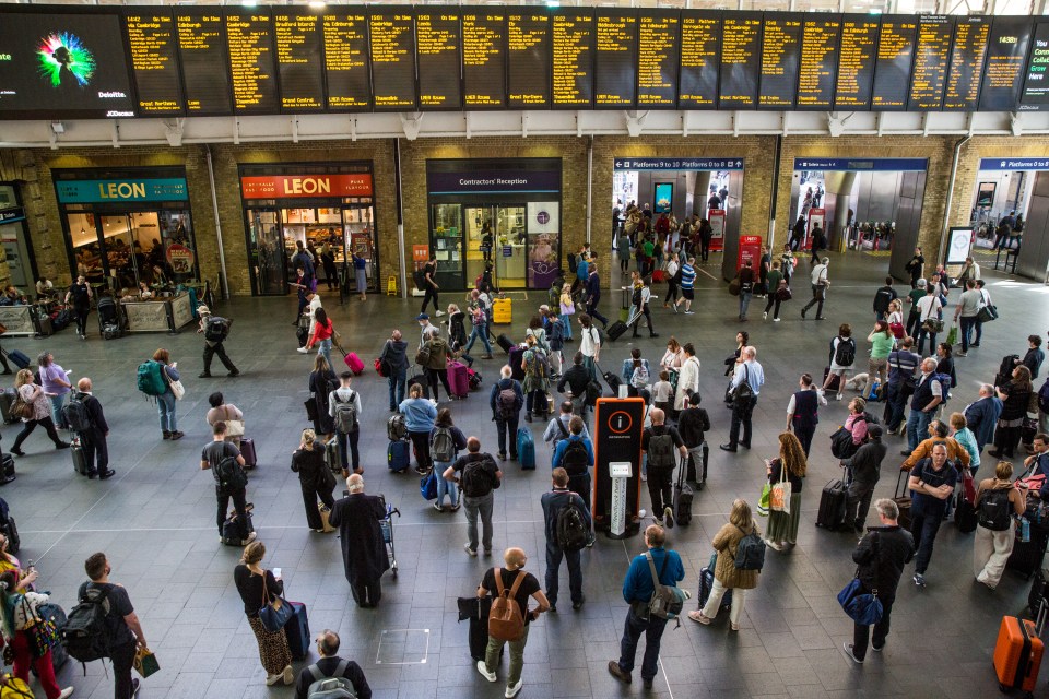 Passengers waited to board trains in Kings Cross, London