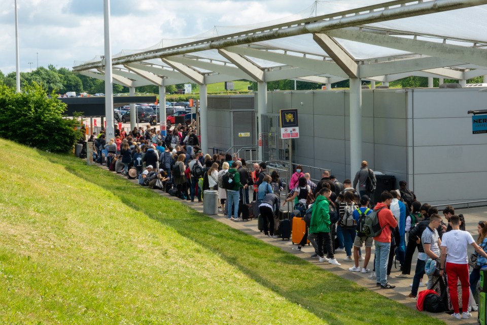 People queuing for busses to leave Stansted Airport in Essex on Wednesday morning