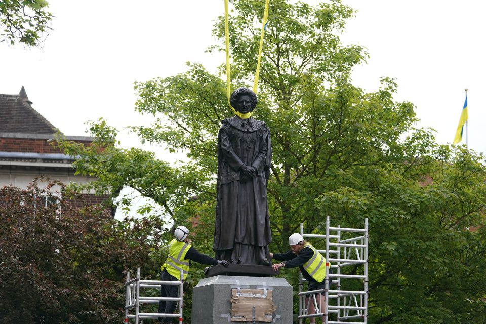 A statue of Iron Lady Margaret Thatcher is egged from behind a 'security fence' less than two hours after being installed