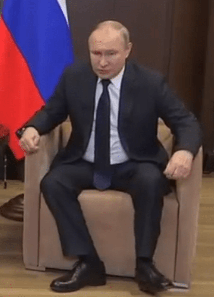 Vladimir Putin once again did not look well as he grimaced and twitched his feet during the event in Sochi