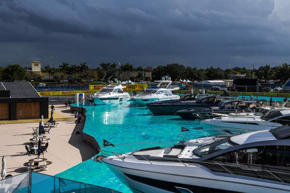 Yachts are parked on fake waters at a visitor stand