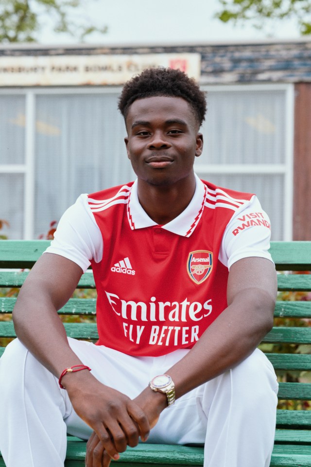 Saka posing in the new Arsenal home shirt